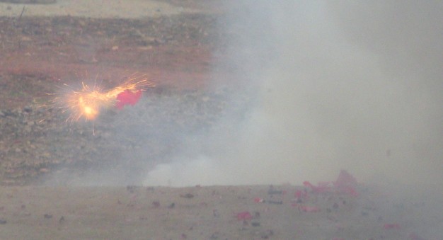 A firecracker explodes at a New Year celebration.